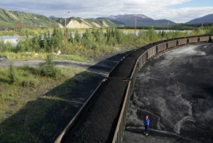 Coal traveling from the Usibelli Coal Mine to Fairbanks. Note the color of the ground. 